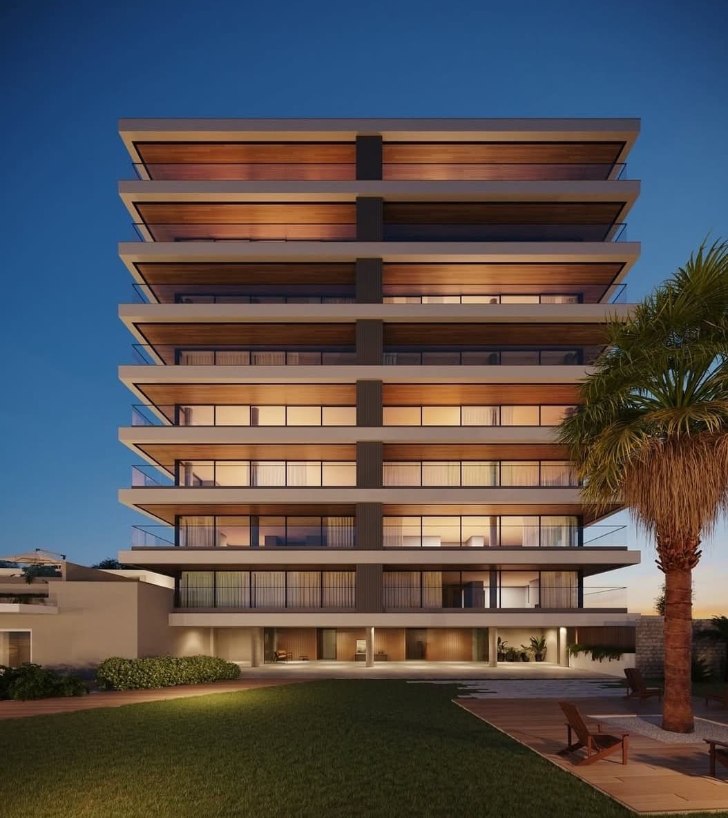 Perspectiva do One Residence ao entardecer, com varandas amadeiradas e esquadrias piso-teto